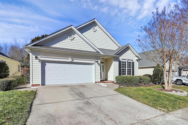 view of front of house with a garage and a front yard