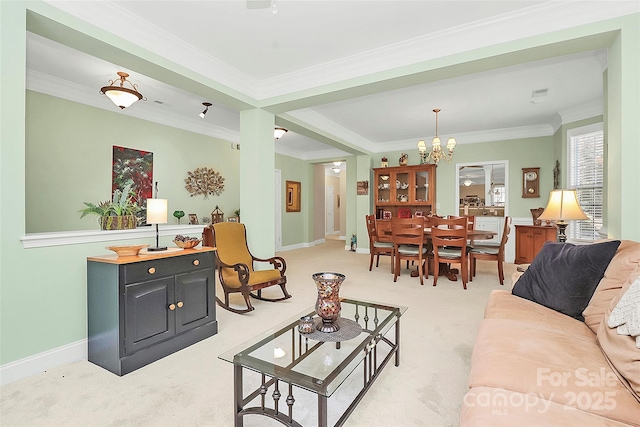 carpeted living room featuring crown molding and a chandelier