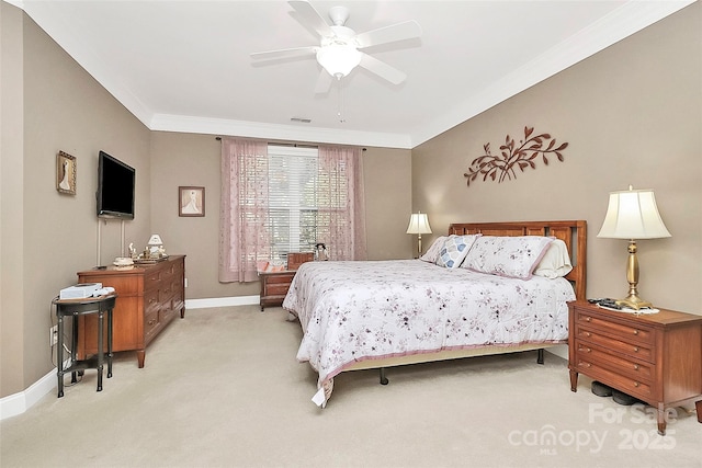 carpeted bedroom featuring crown molding and ceiling fan