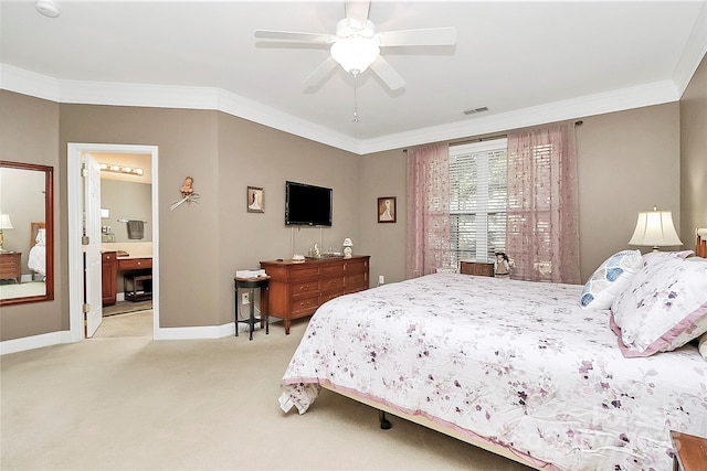 carpeted bedroom featuring ensuite bathroom, ceiling fan, and ornamental molding