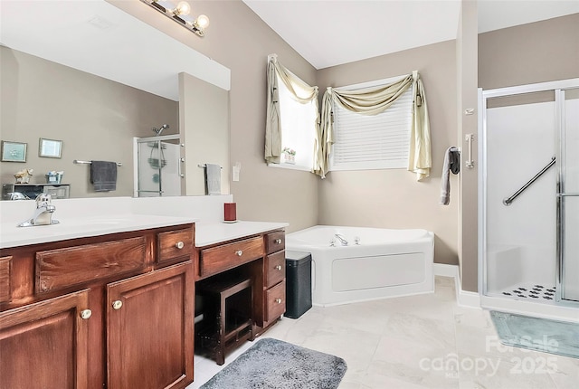 bathroom with tile patterned floors, vanity, and independent shower and bath