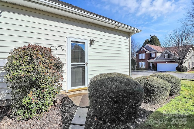 doorway to property with a garage