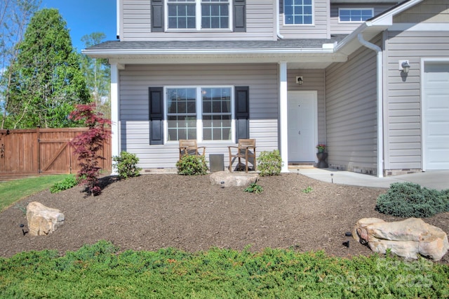 view of front of home with a garage and a porch