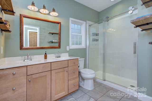 bathroom featuring vanity, toilet, tile patterned floors, and walk in shower