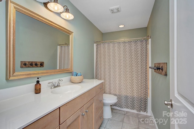 full bathroom with vanity, shower / tub combo with curtain, tile patterned floors, and toilet