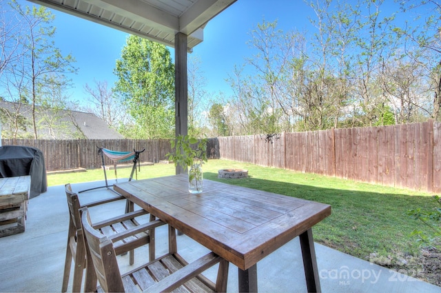 view of patio featuring grilling area and an outdoor fire pit