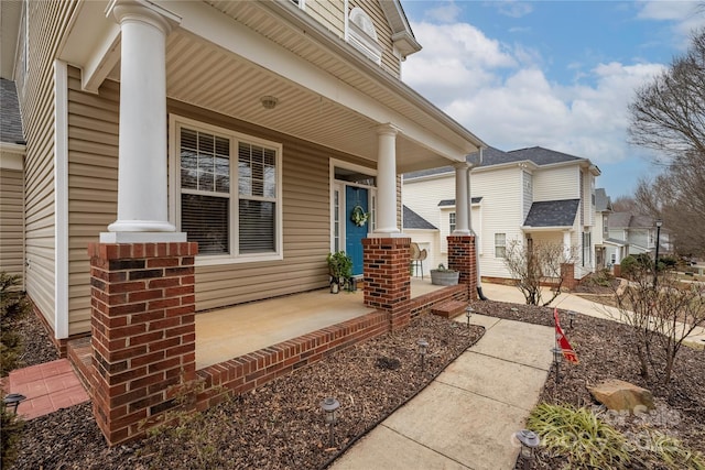 property entrance featuring a porch