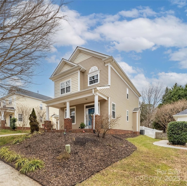 view of front of house with a front lawn and covered porch