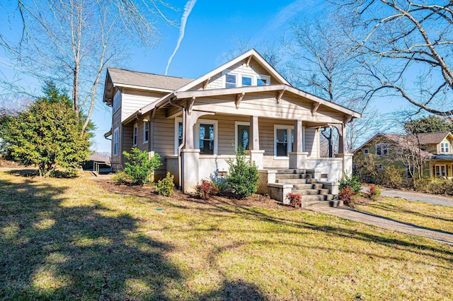 bungalow-style house with a front yard and a porch