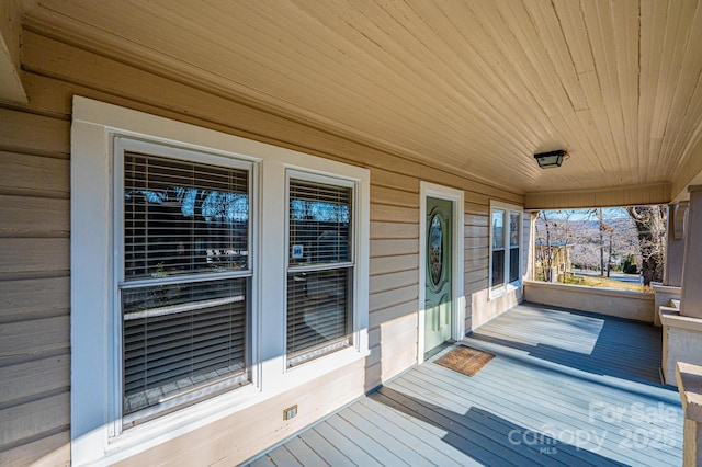 wooden deck featuring a porch