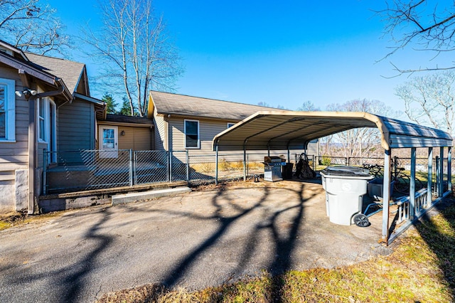 view of side of property featuring a carport