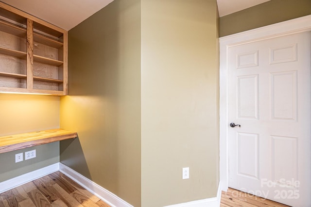 unfurnished office featuring light hardwood / wood-style floors