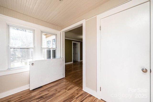 interior space featuring hardwood / wood-style flooring and wood ceiling