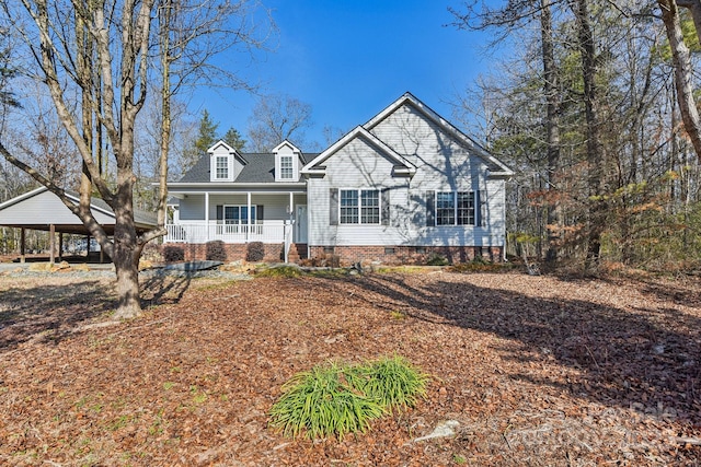 view of front of house featuring a carport and covered porch