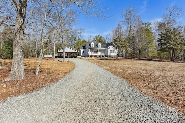 view of front of house featuring a carport and covered porch