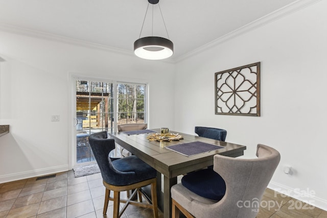 tiled dining area with crown molding