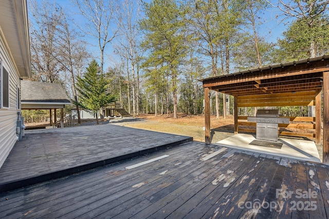 wooden terrace featuring grilling area