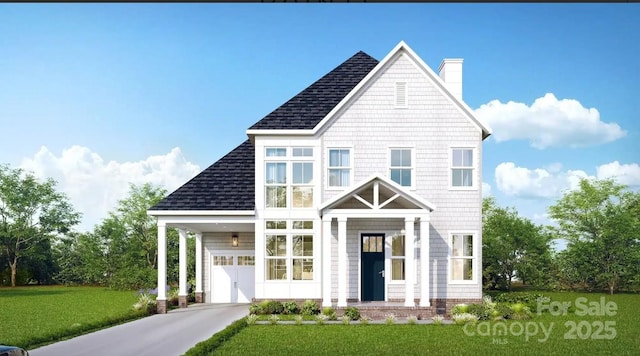 view of front of home featuring a garage and a front lawn