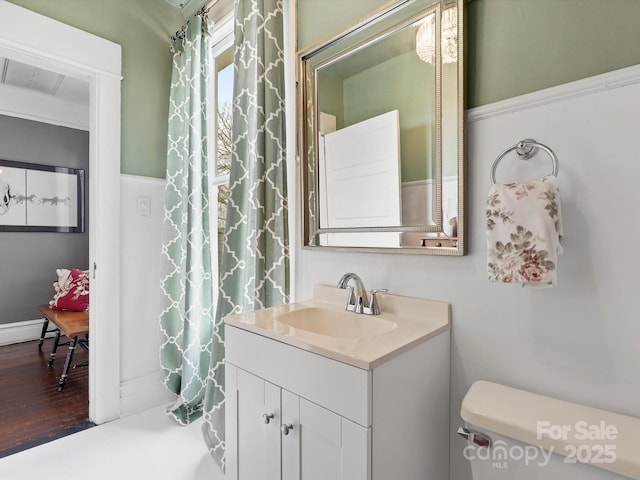 bathroom with vanity and toilet