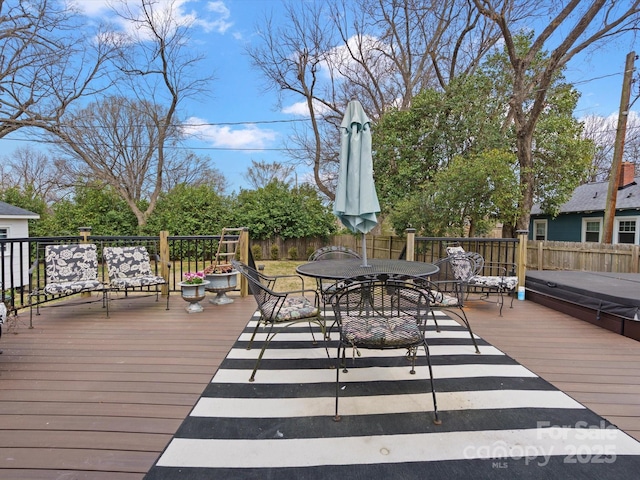 wooden terrace with outdoor dining space