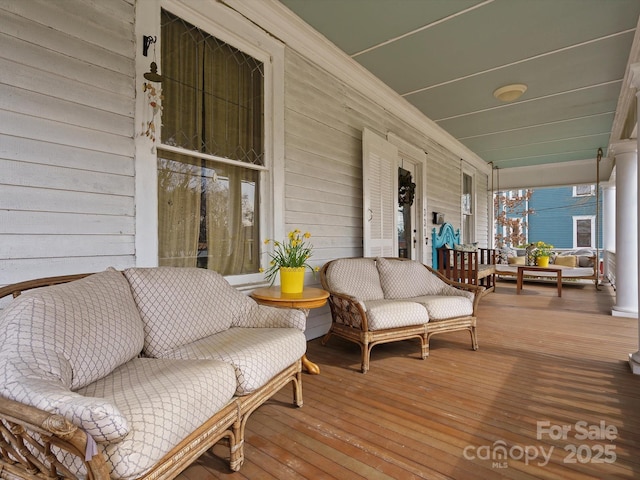 wooden terrace with a porch