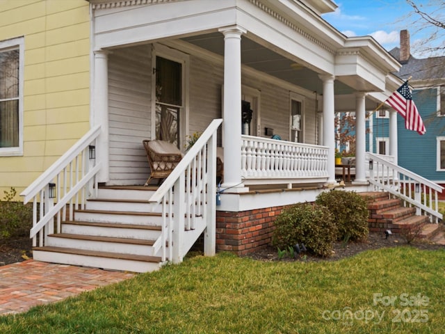 view of exterior entry with a porch