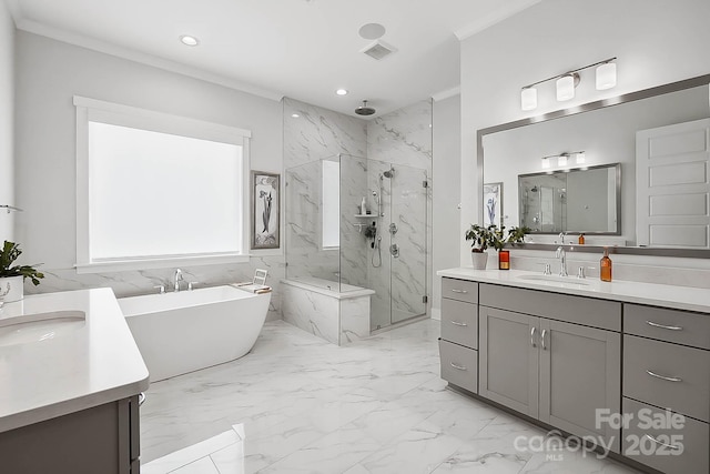 bathroom with crown molding, vanity, and plus walk in shower