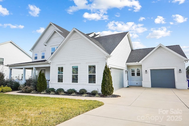 view of front of house featuring a garage and a front yard