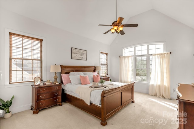 carpeted bedroom with multiple windows, high vaulted ceiling, and ceiling fan