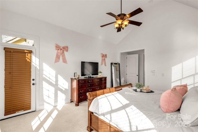 bedroom with high vaulted ceiling, light colored carpet, and ceiling fan