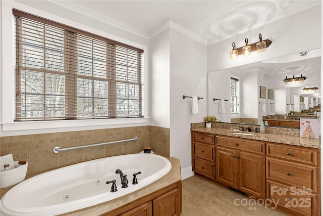 bathroom with tile patterned flooring, ornamental molding, a bath, and vanity