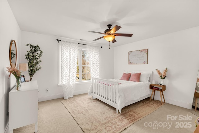 carpeted bedroom featuring ceiling fan