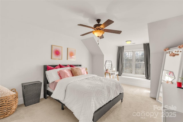 bedroom with light carpet, lofted ceiling, and ceiling fan