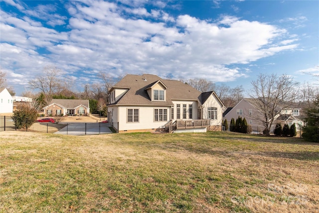 rear view of house with a yard