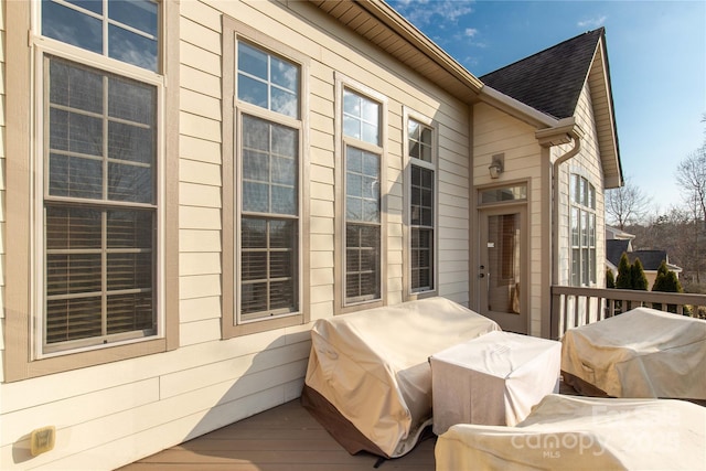 exterior space with grilling area and a deck