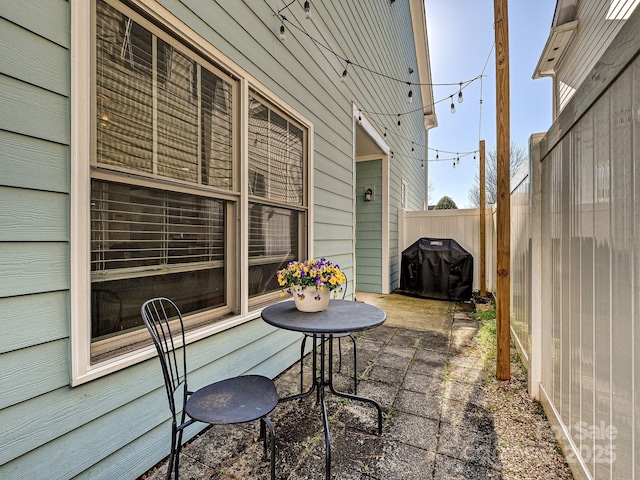 view of patio featuring a grill