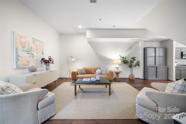 living room with dark hardwood / wood-style floors