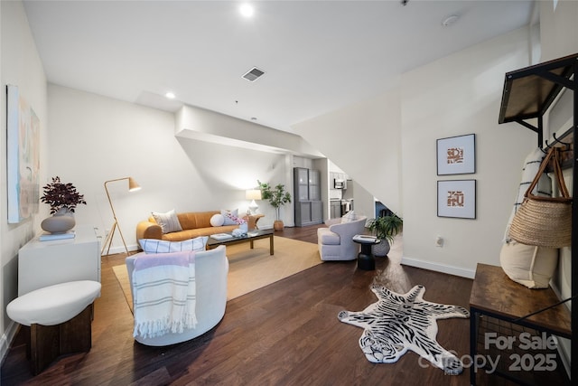 living room featuring dark wood-type flooring