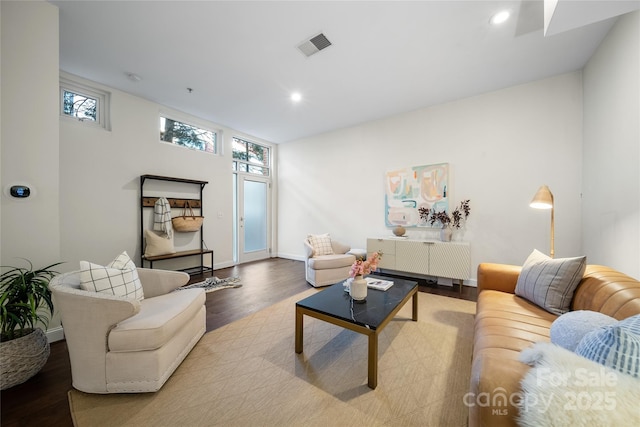 living room with light hardwood / wood-style floors and a wealth of natural light