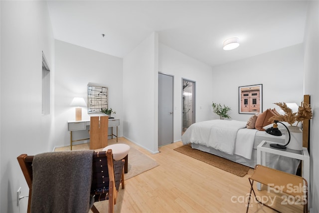 bedroom featuring wood-type flooring