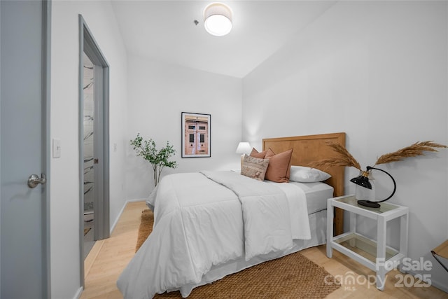 bedroom with light wood-type flooring