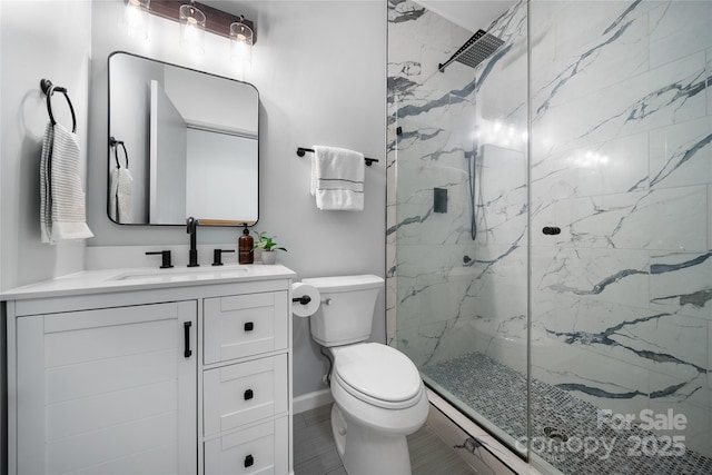 bathroom with vanity, toilet, and an enclosed shower