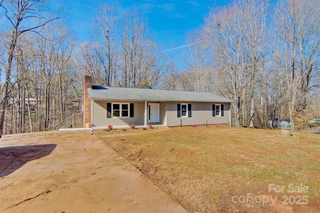 single story home with a front lawn