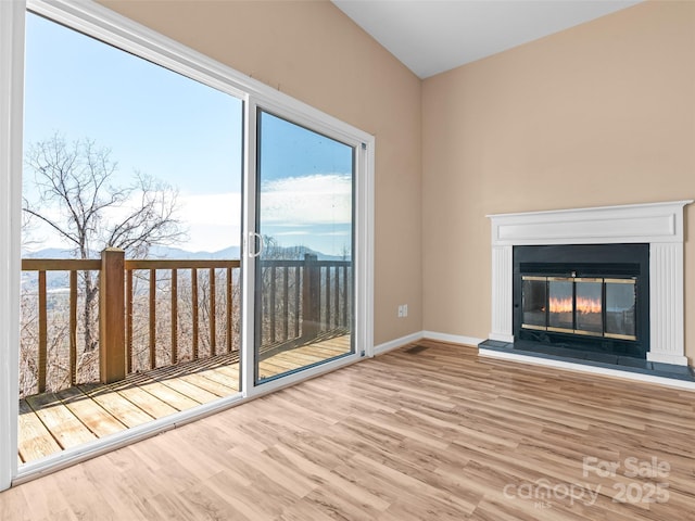 unfurnished living room featuring hardwood / wood-style flooring