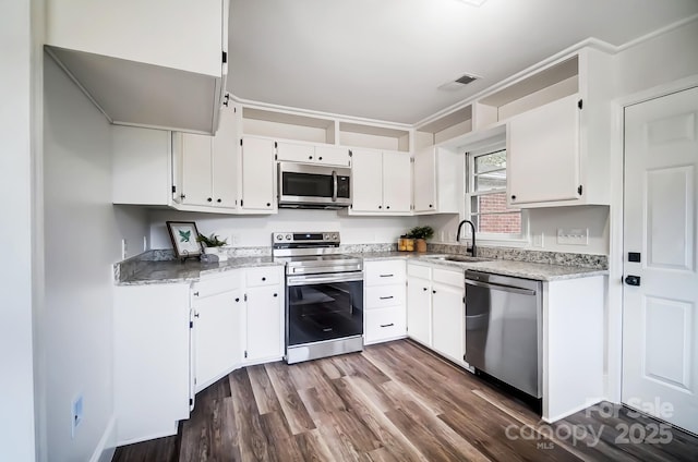 kitchen featuring white cabinetry, sink, dark wood-type flooring, and stainless steel appliances