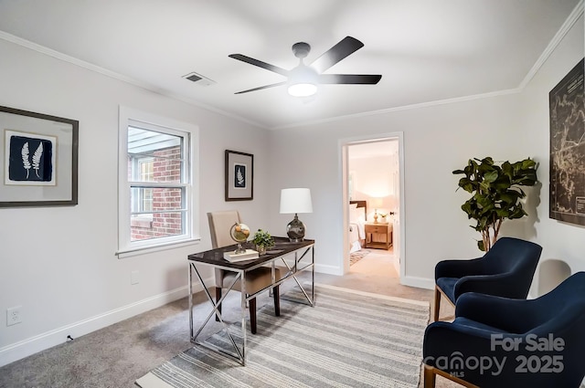 carpeted home office with crown molding and ceiling fan