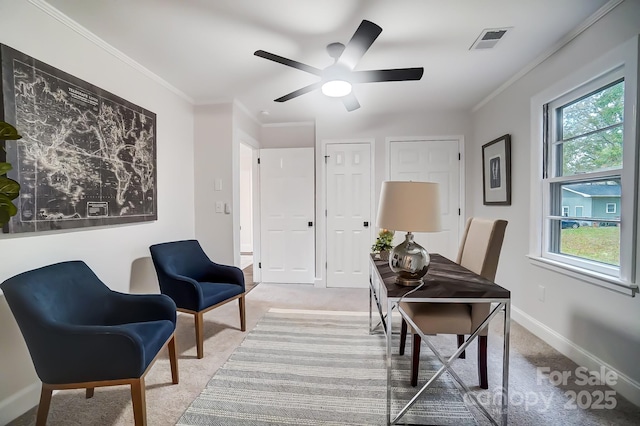 carpeted office with crown molding and ceiling fan