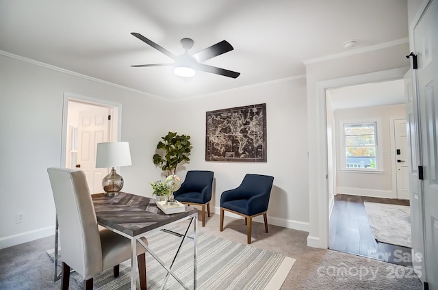 interior space featuring crown molding, carpet flooring, and ceiling fan