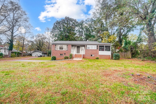 ranch-style house with a front yard