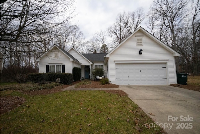 view of front of property with a garage and a front yard